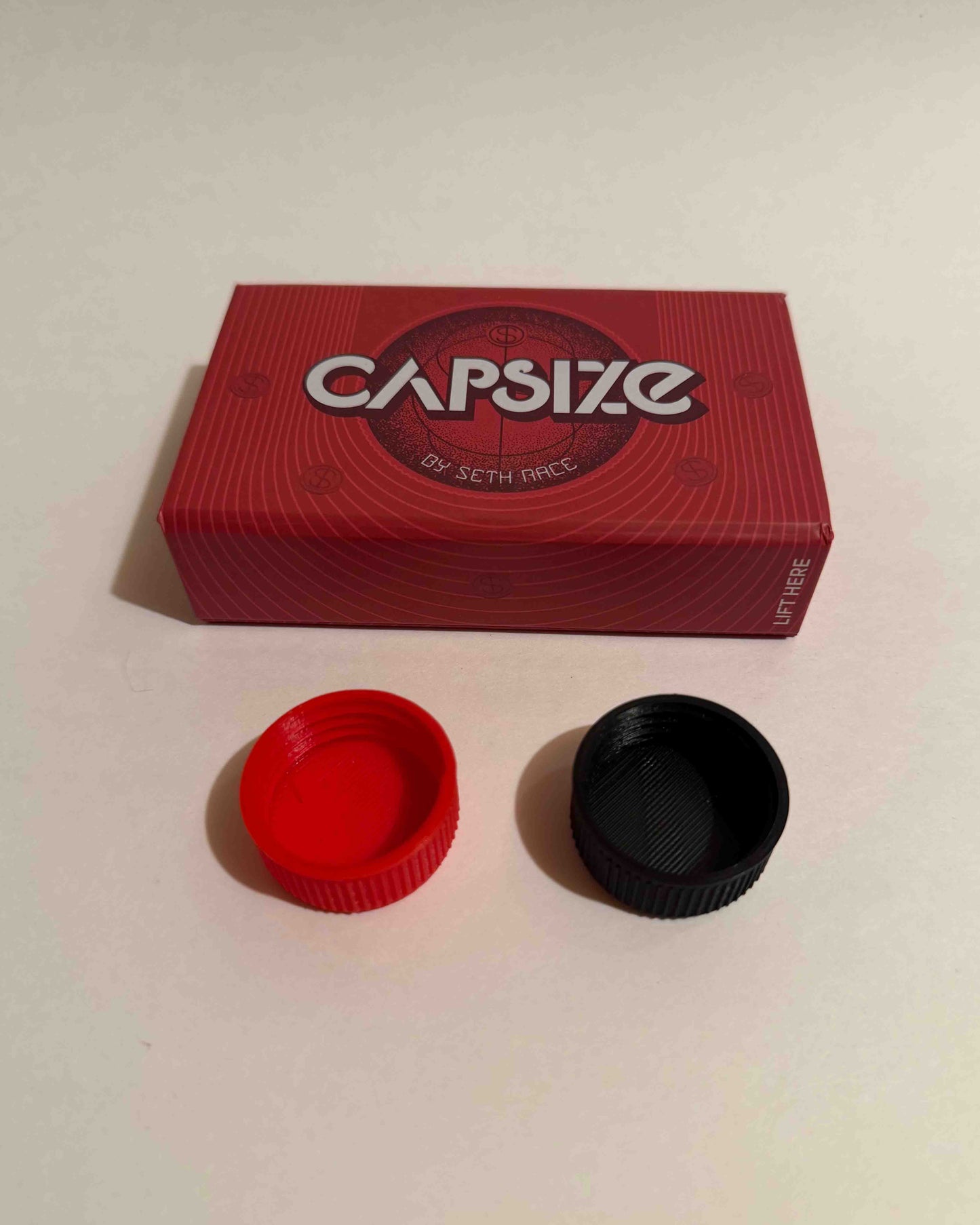 Capsize 2.0 by Seth Race (1 Red & 1 Black Cap)